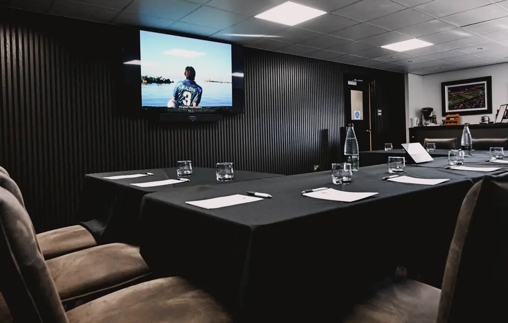 Table set up at McMenemy's Grimsby Town with GTFC promotions shown on the TV